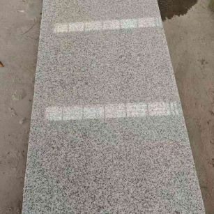 那曲芝麻白光面毛板